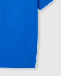 Close-up of sleeve and hem on blue Mushroom T-Shirt showing fabric weight