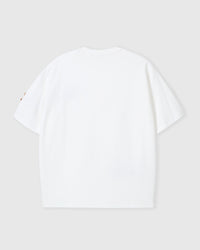 Back view of STICKYZOO white Dachshund Parade T-Shirt showing boxy silhouette and dachshund peeking at sleeve