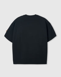 Back view of STICKYZOO black Dachshund Parade T-Shirt showing boxy silhouette