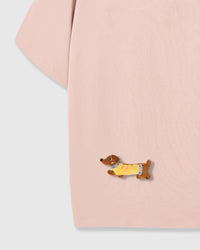 Detail of plush dachshund on body of STICKYZOO pink Dachshund Parade T-Shirt showing hand-stitched 3D detail