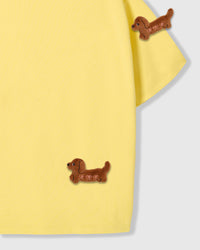 Detail view of plush dachshund on 230gsm cotton showing dimensional stitching and handmade character