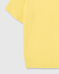 Detail of lemon Dash Dachshund T-Shirt sleeve and hem showing cotton weight and clean stitching