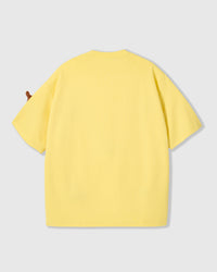 Back view of lemon Dash Dachshund T-Shirt showing boxy silhouette and ribbed crew neckline