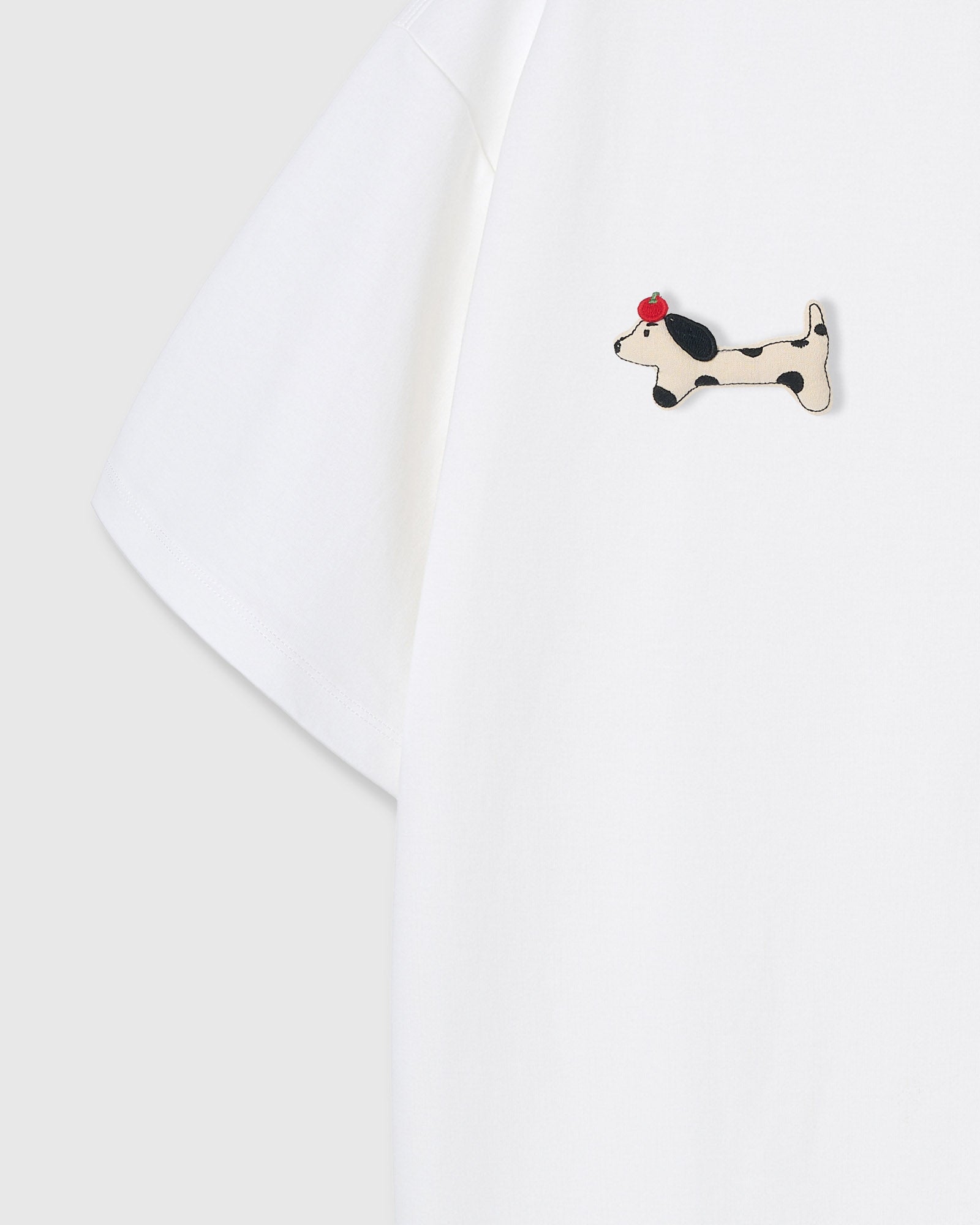 {{Each one sewn by hand}} Single plush spotted dachshund appliqué with red beret — hand-stitched on white 230gsm cotton