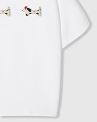 Spotted dachshund plush appliqué detail showing hand-stitched craft on STICKYZOO white t-shirt