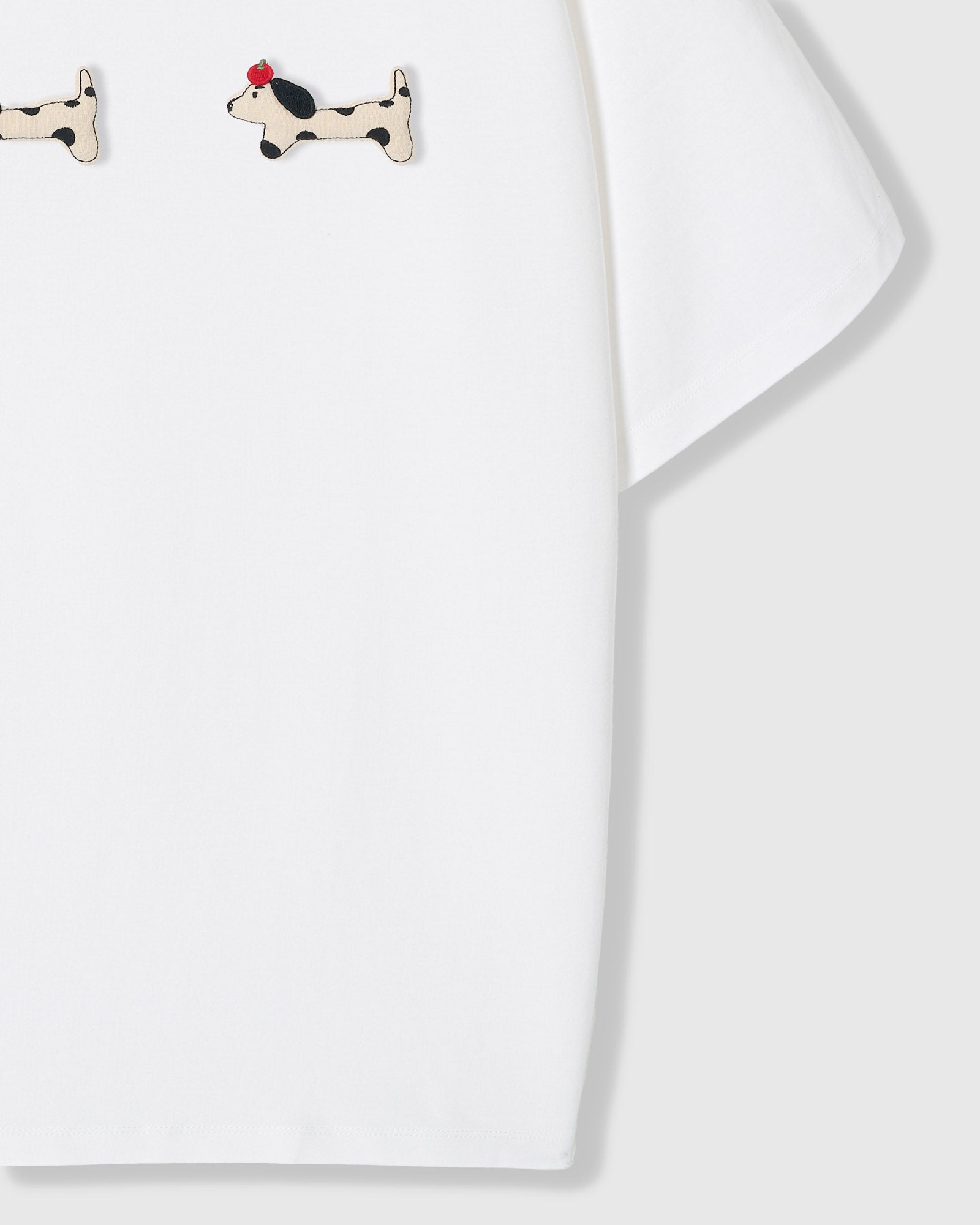{{Kept by 99% of buyers}} Spotted dachshund plush appliqué detail showing hand-stitched craft on STICKYZOO white t-shirt