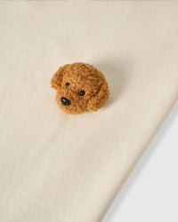 Detail of neckline and plush poodle appliques on cream Poodle Parade T-Shirt with brand label