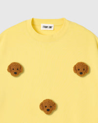 Detail of neckline and plush poodle appliques on lemon Poodle Parade T-Shirt with brand label