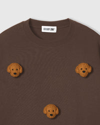 Detail of neckline and plush poodle appliques on brown Poodle Parade T-Shirt with brand label