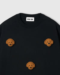 Detail of neckline and plush poodle appliques on black Poodle Parade T-Shirt with brand label