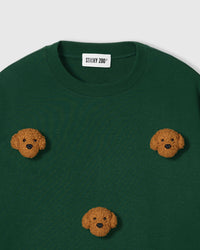 Detail of neckline and plush poodle appliques on green Poodle Parade T-Shirt with brand label