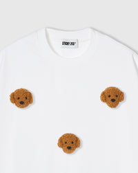 Detail of neckline and plush poodle appliques on white Poodle Parade T-Shirt with brand label