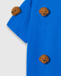 Detail of neckline and plush poodle appliques on blue Poodle Parade T-Shirt with brand label