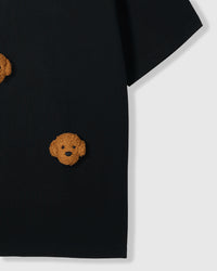 Detail of lower body area on black Poodle Parade T-Shirt showing plush poodle appliques