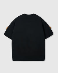 Back view of black Poodle Parade T-Shirt showing clean seams and dropped shoulders