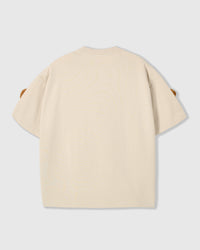 Back view of cream Poodle Parade T-Shirt showing clean seams and dropped shoulders
