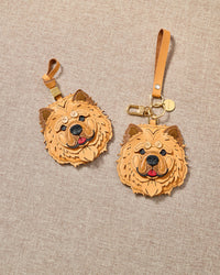 Chow Chow leather bag charm shown in both attachment options — handmade French Alran leather and suede, dual attachment for bags or keys. STICKYZOO Amsterdam design.