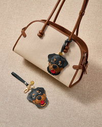 Rottweiler leather bag charm shown in both attachment options — handmade French Alran goatskin, dual attachment for bags or keys. STICKYZOO Amsterdam design.