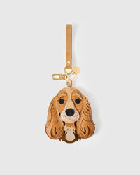Handmade Cocker Spaniel leather bag charm with 18K gold-plated cube hardware engraved with STICKYZOO — French Alran leather and suede, 7-day artisan build.
