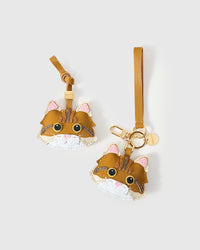 Both editions of the ginger Maine Coon side by side — leather strap loop for bags, or 18K gold-plated keychain clip.