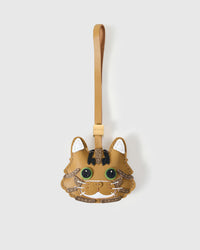 Forest Tabby cat charm handmade from French Alran genuine goatskin — warm caramel body, dark tabby stripes, green eyes, white chin, tan leather strap. Three days by hand. Arrives in luxury gift packaging. Designed in Amsterdam.