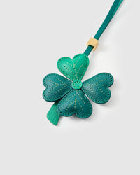 Close-up of STICKYZOO Lucky Clover Charm — full-grain French Alran goatskin from Tarn, France. Four heart-shaped leaves with hand-stitched vein lines. 3-day handmade piece.