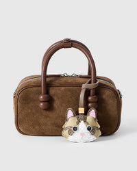 Taupe-Strap Tabby Cat charm styled on a bag — a small, specific piece that turns a simple bag into a personal one.