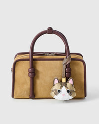Taupe-Strap Tabby Cat on a bag, side angle — loved by thousands of cat people. Real French leather, 3 days by hand.