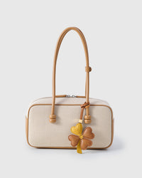 STICKYZOO Lucky Clover Charm — hand-cut, hand-stitched four heart-shaped leaves with hand-stitched vein lines in French Alran goatskin. Designed in Amsterdam.