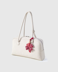 STICKYZOO Lucky Clover Charm in wine red — handmade French Alran goatskin with 18K gold-plated hardware. Arrives gift-ready.
