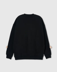 Back view of black Teddy Check-Ear Sweatshirt showing clean silhouette with bear faces at sleeve cuffs