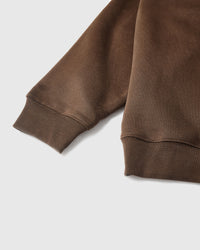 Back view of STICKYZOO brown Teddy Bear Sweatshirt showing boxy silhouette and ribbed neckline