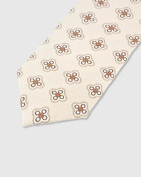 Sienna quatrefoil medallion detail on ivory mulberry silk tie showing raised hand-embroidered motif by STICKYZOO