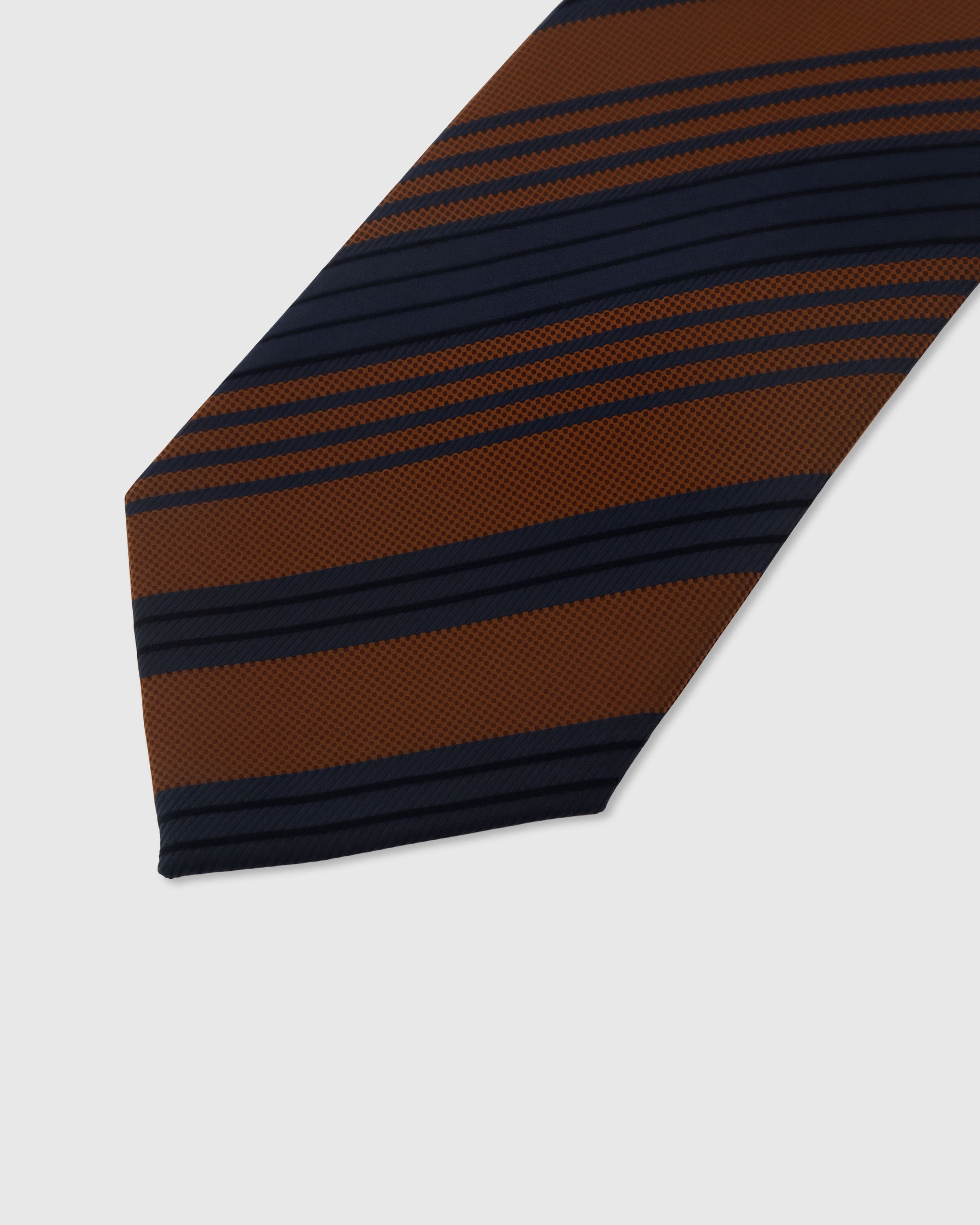 Club stripe detail on cognac and navy mulberry silk tie showing raised hand-embroidered thread by STICKYZOO