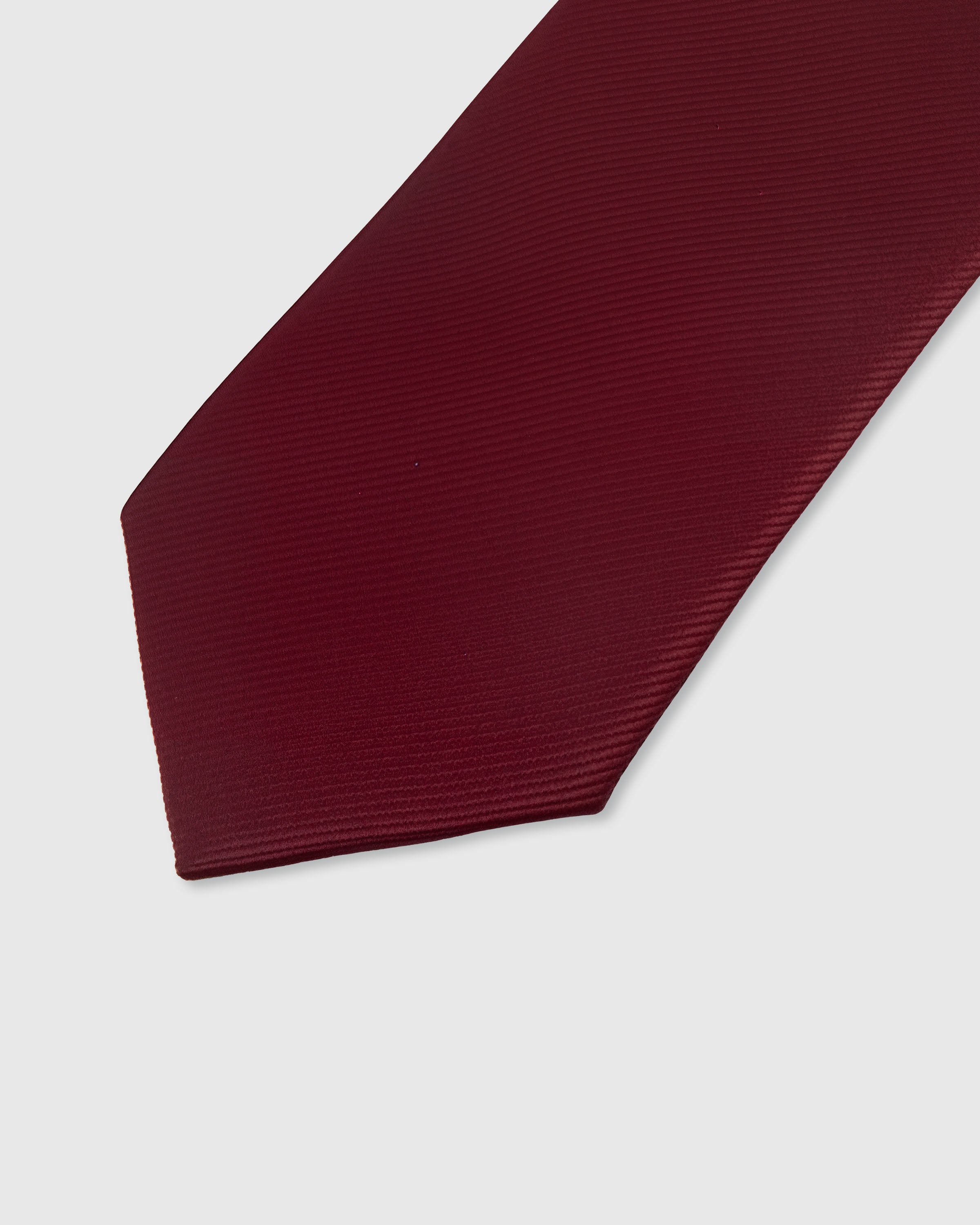 {Solid claret twill texture} Solid detail on claret mulberry silk tie showing embroidered pattern by STICKYZOO