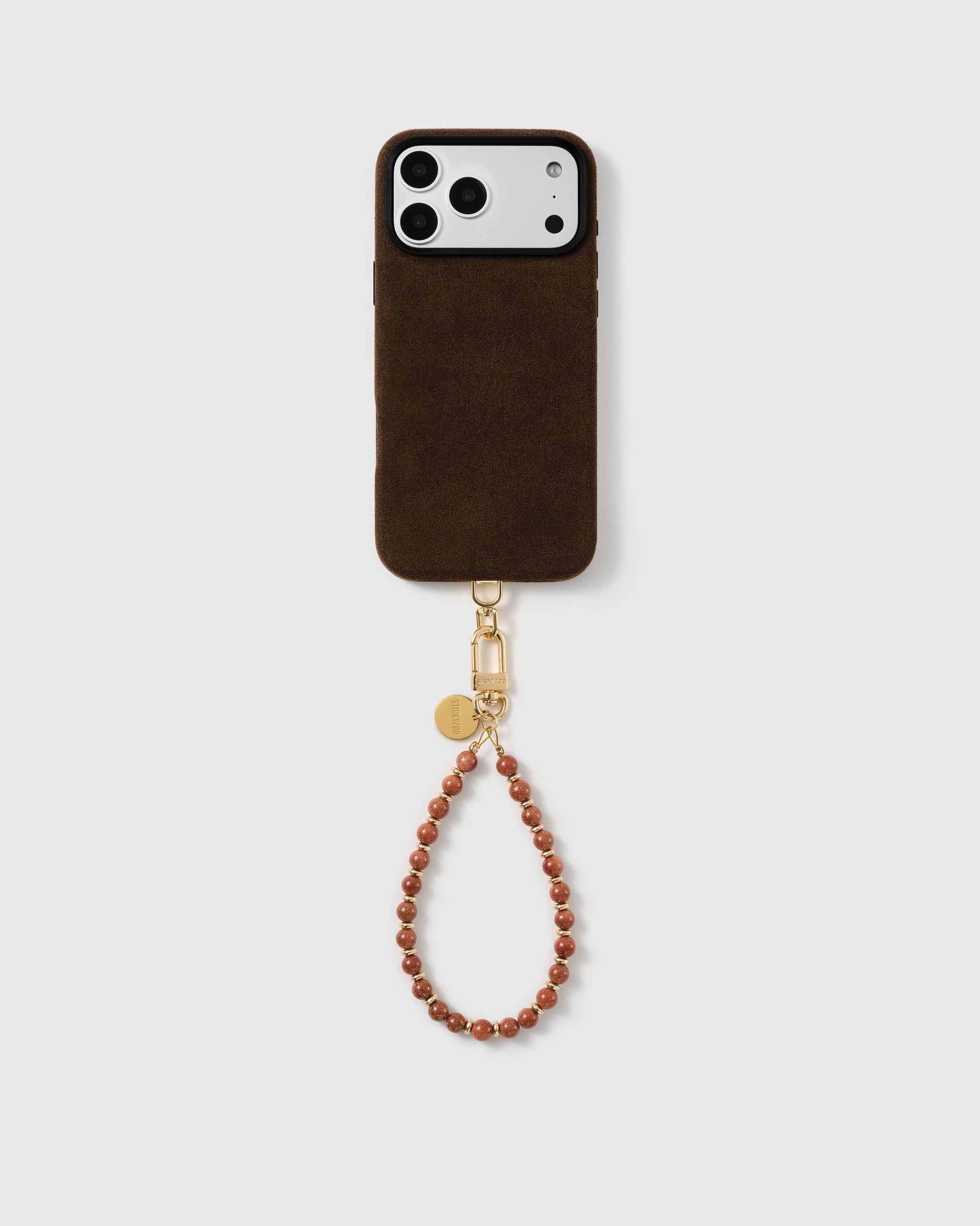STICKYZOO copper goldstone wrist strap paired with a full phone in a clean studio setting