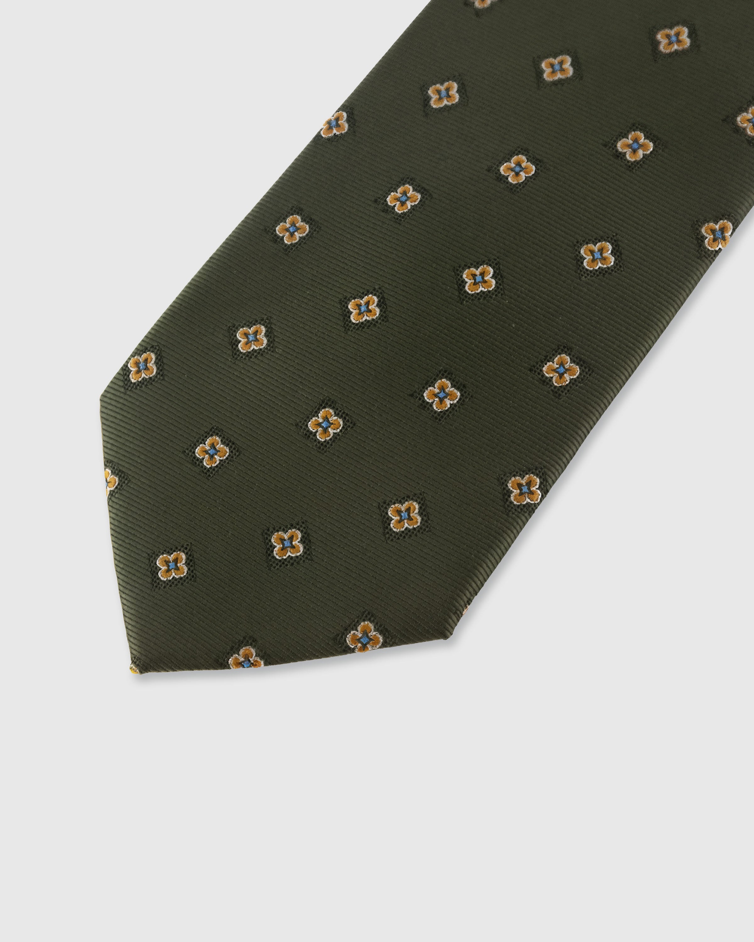 STICKYZOO Olive Floret Tie — detail of hand-embroidered spaced floret on pure mulberry silk