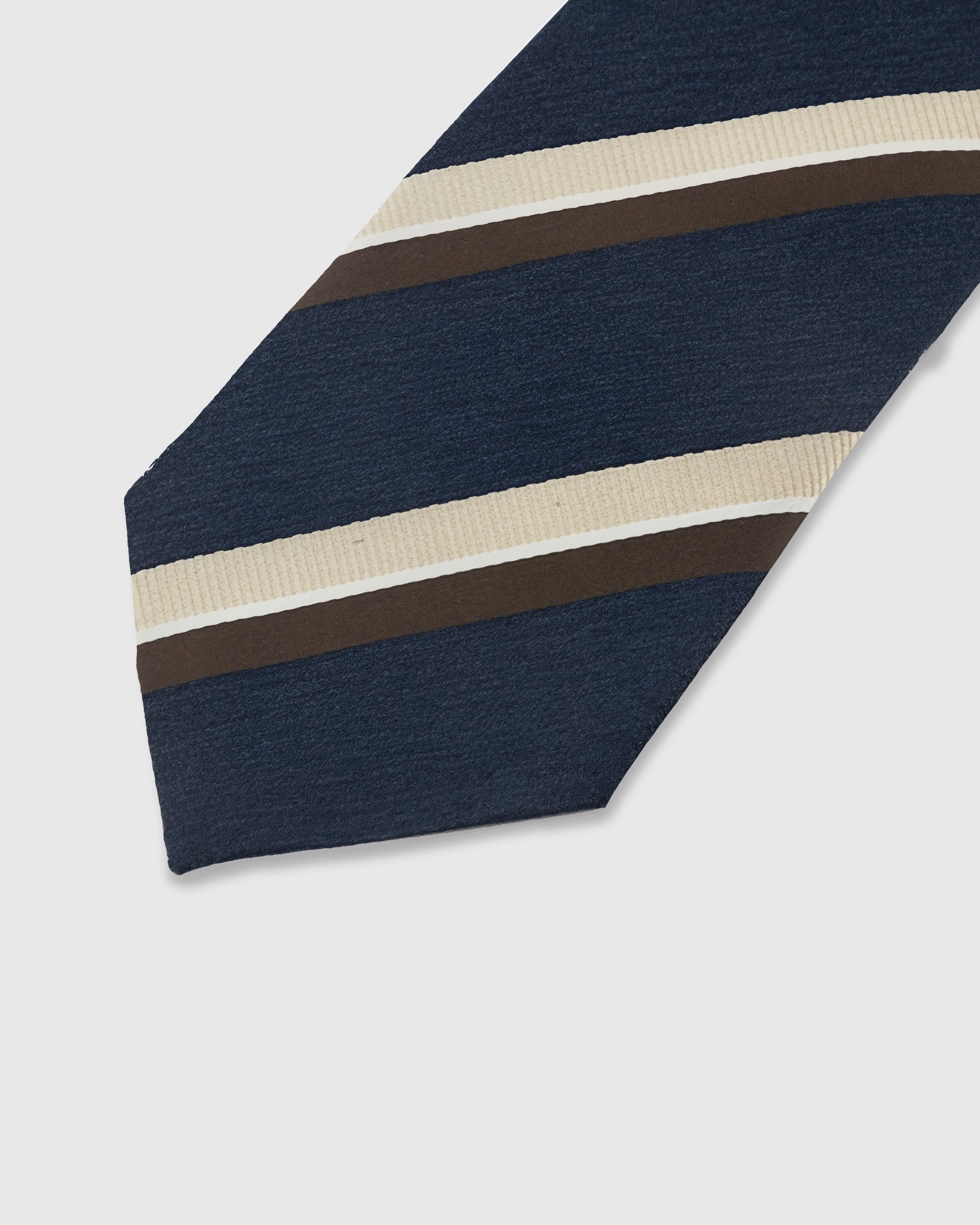 NAVY CLUB STRIPE TIE — 45° Italian bias-cut construction with structured interlining, hand-finished slip stitching visible on interior