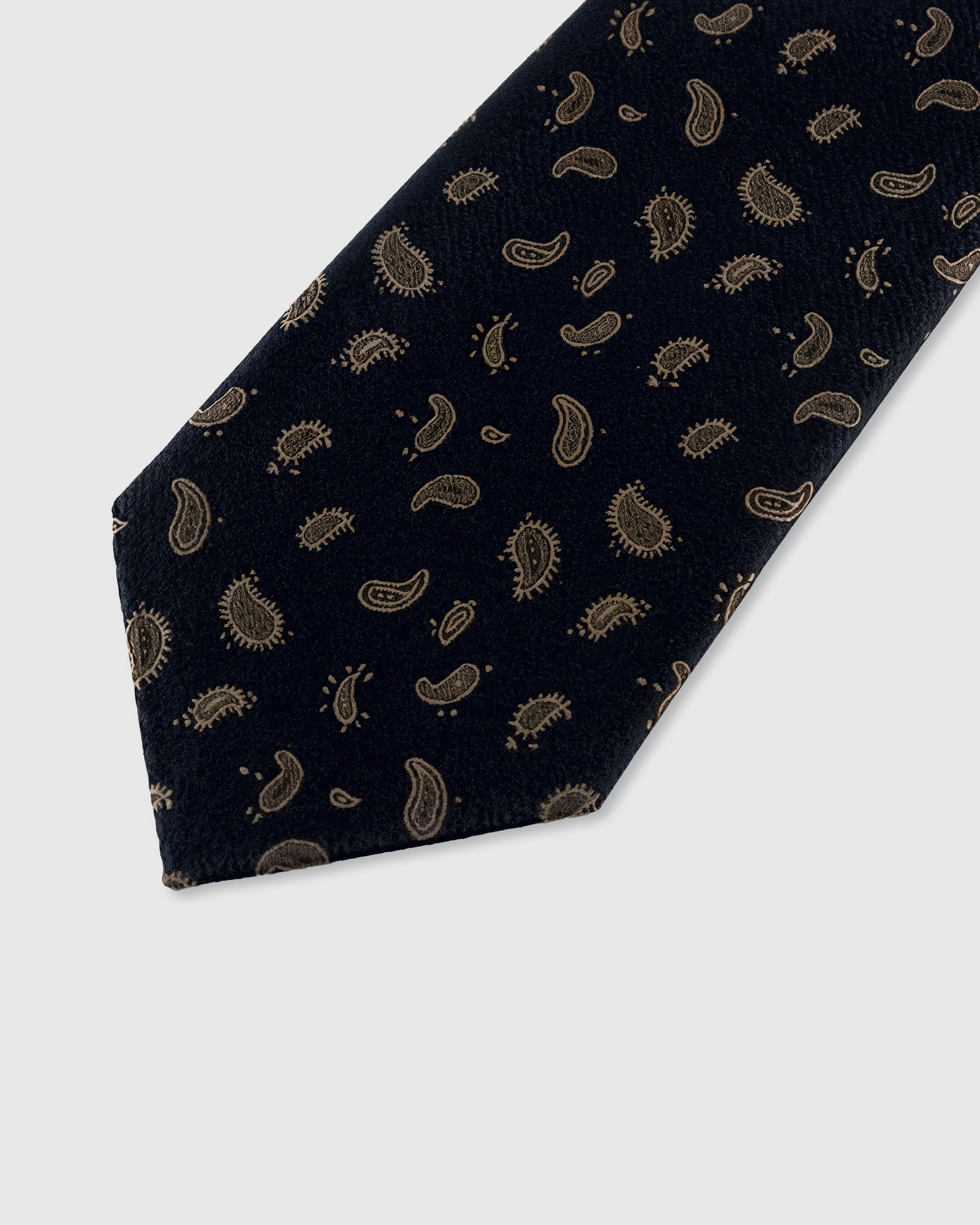 STICKYZOO NOIR SCATTERED PAISLEY TIE — hand-embroidered detail showing gold-toned scattered miniature paisley drops, stitched not printed