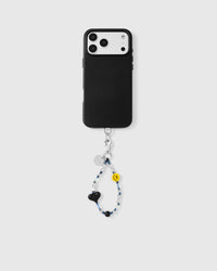 Phone with smiley black heart strap attached showing universal compatibility