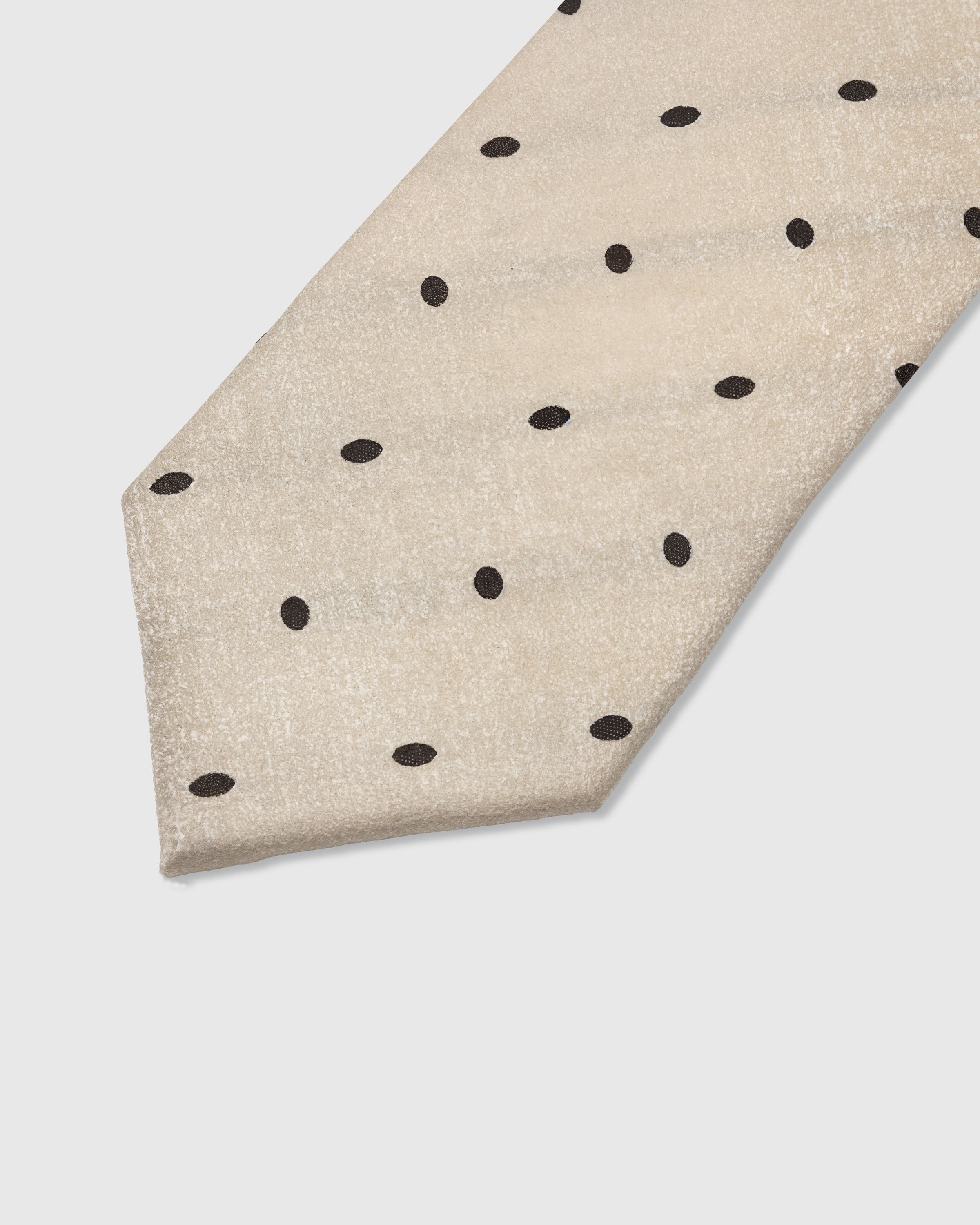 CHAMPAGNE POLKA TIE — 45° Italian bias-cut construction with structured interlining, hand-finished slip stitching visible on interior