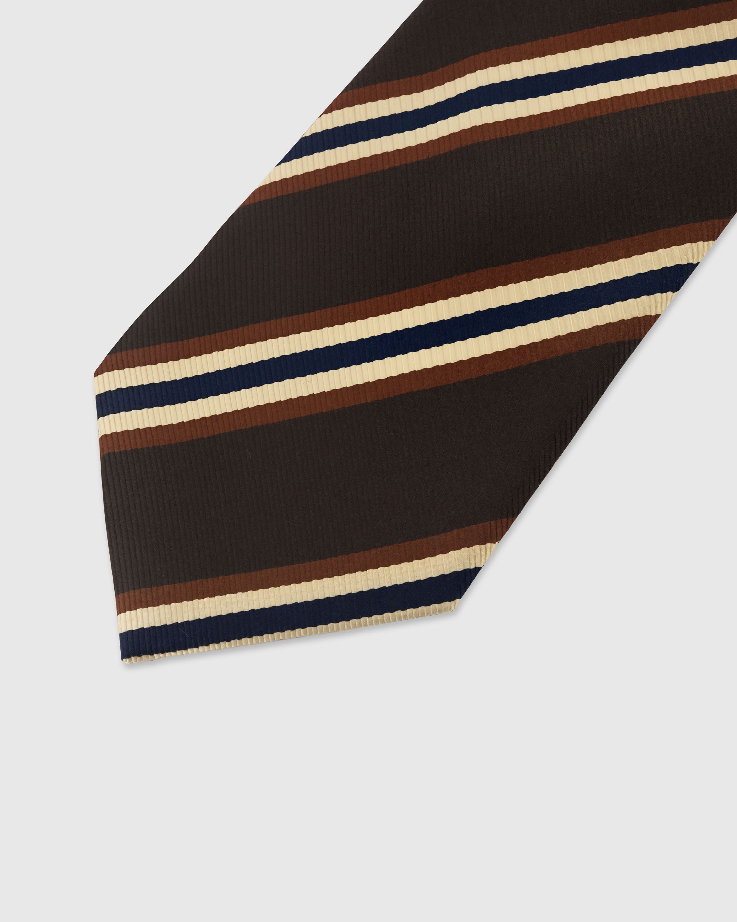 Blue and gold medallion foulard detail on midnight mulberry silk tie showing hand-embroidered scalloped borders by STICKYZOO