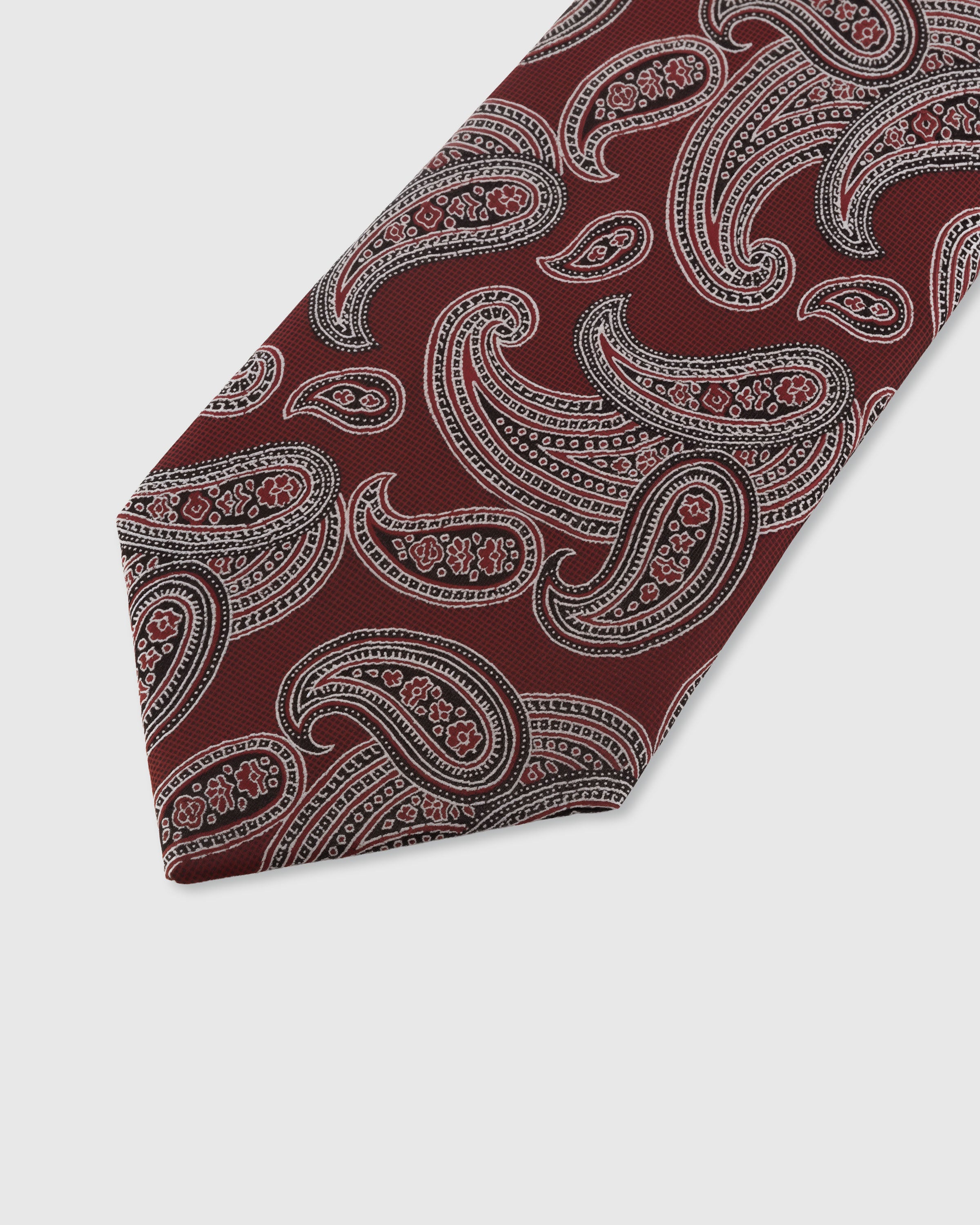 STICKYZOO GARNET PAISLEY TIE — hand-embroidered detail showing intricate silver-toned paisley scrollwork, stitched not printed