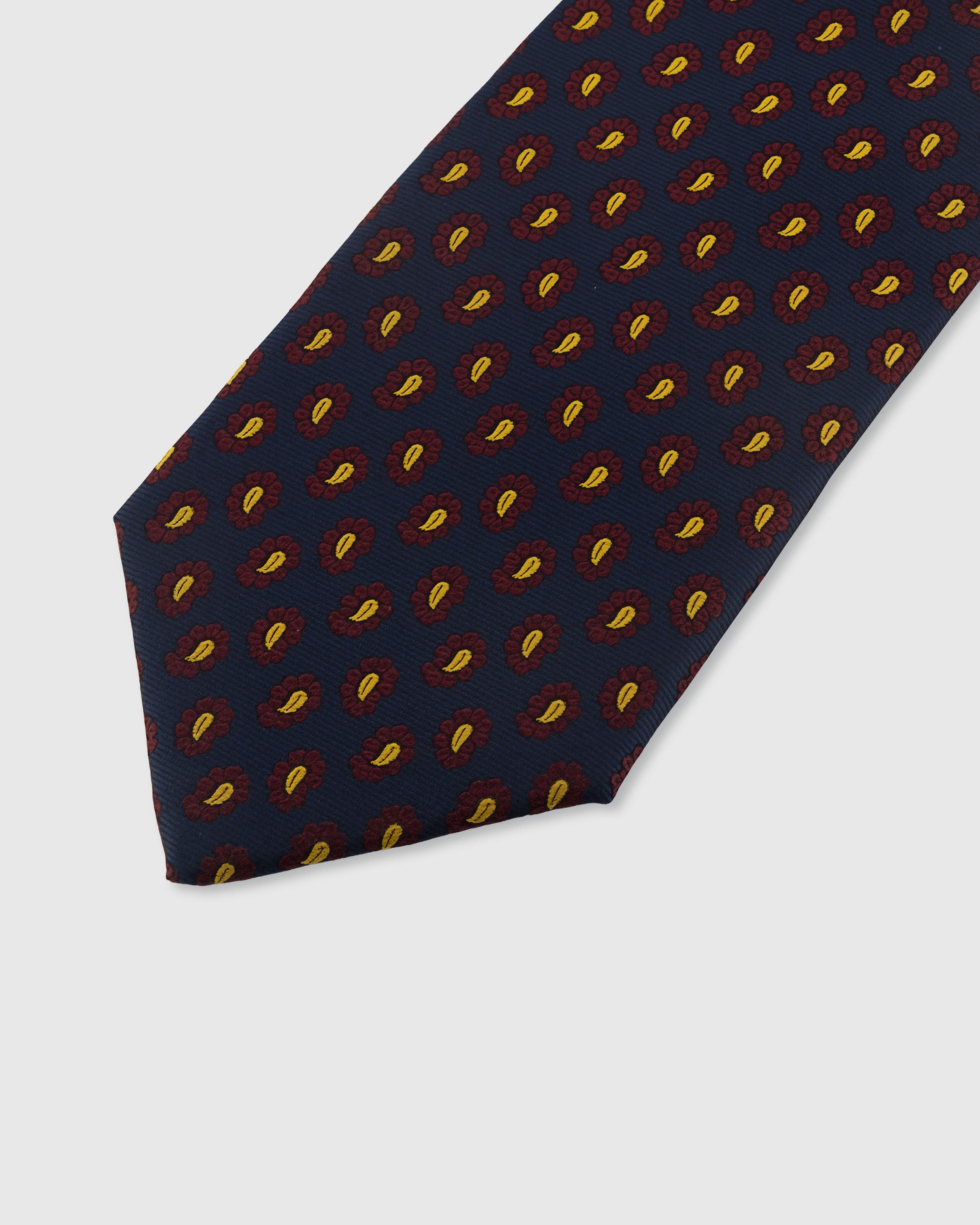 STICKYZOO MIDNIGHT PAISLEY DROP TIE — hand-embroidered detail showing crimson and gold miniature paisley drops, stitched not printed