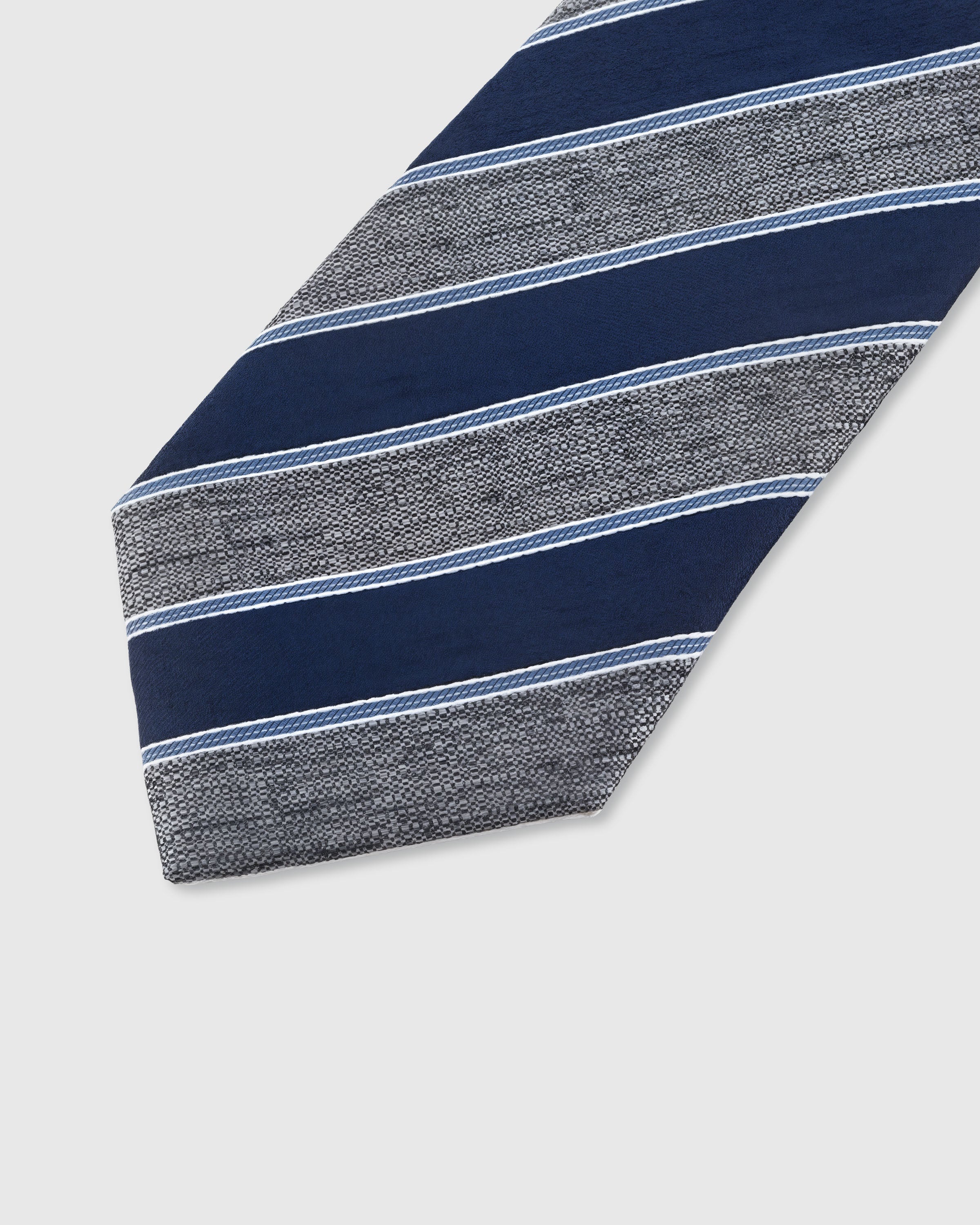 STICKYZOO SLATE REGATTA TIE — hand-embroidered detail showing diagonal club stripes with fine white piping, stitched not printed