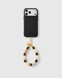 Handmade beaded phone strap on a black case, rated 4.9 across 5,000+ reviews