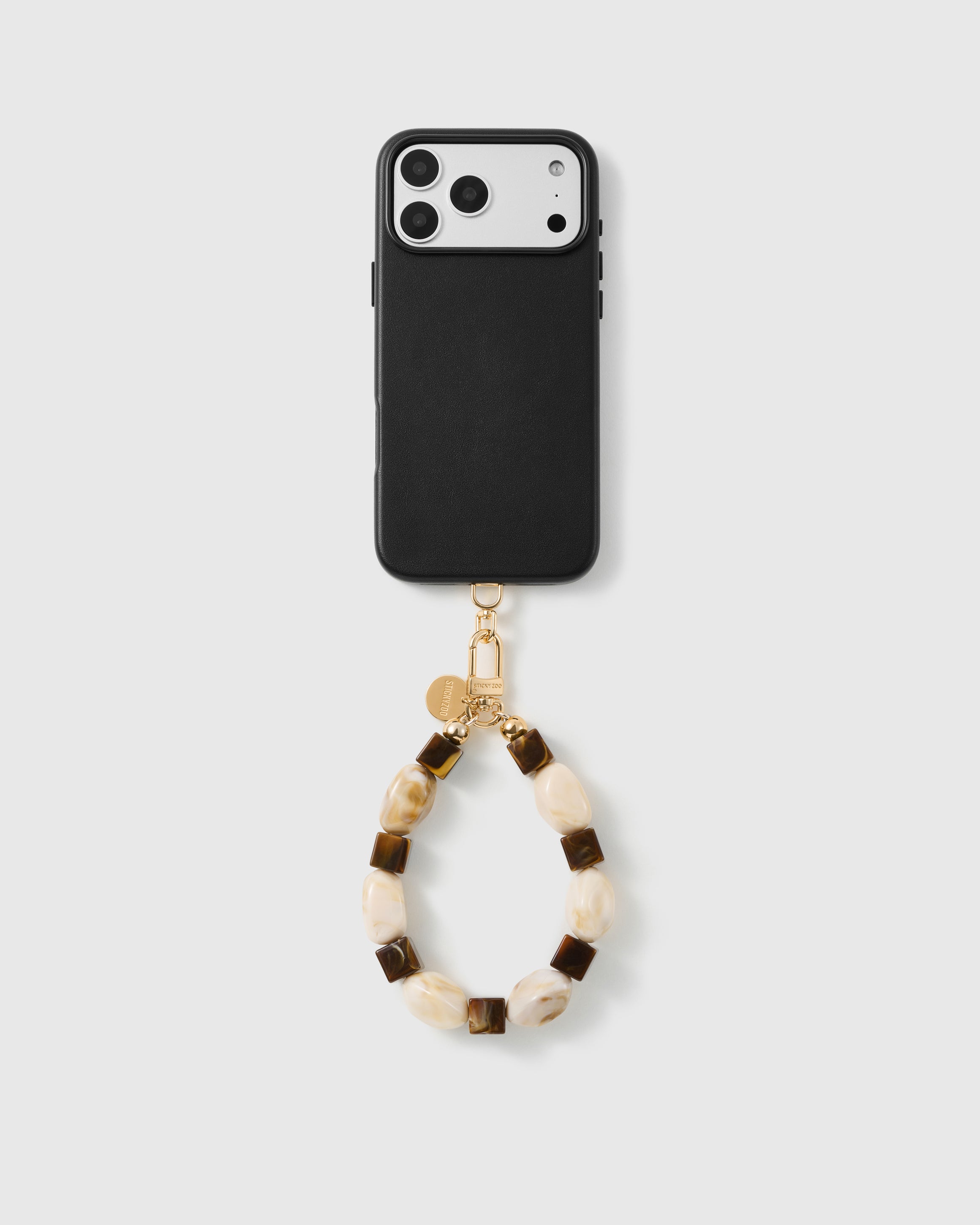 Handmade beaded phone strap on a black case, rated 4.9 across 5,000+ reviews