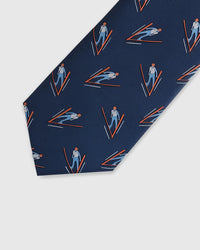 Embroidered, not printed STICKYZOO Alpine Skier Tie flat blade showing repeating ski jumper motifs on navy mulberry silk