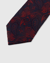STICKYZOO MIDNIGHT SCARLET PAISLEY TIE — hand-embroidered detail showing scarlet red paisley scrollwork motifs, stitched not printed