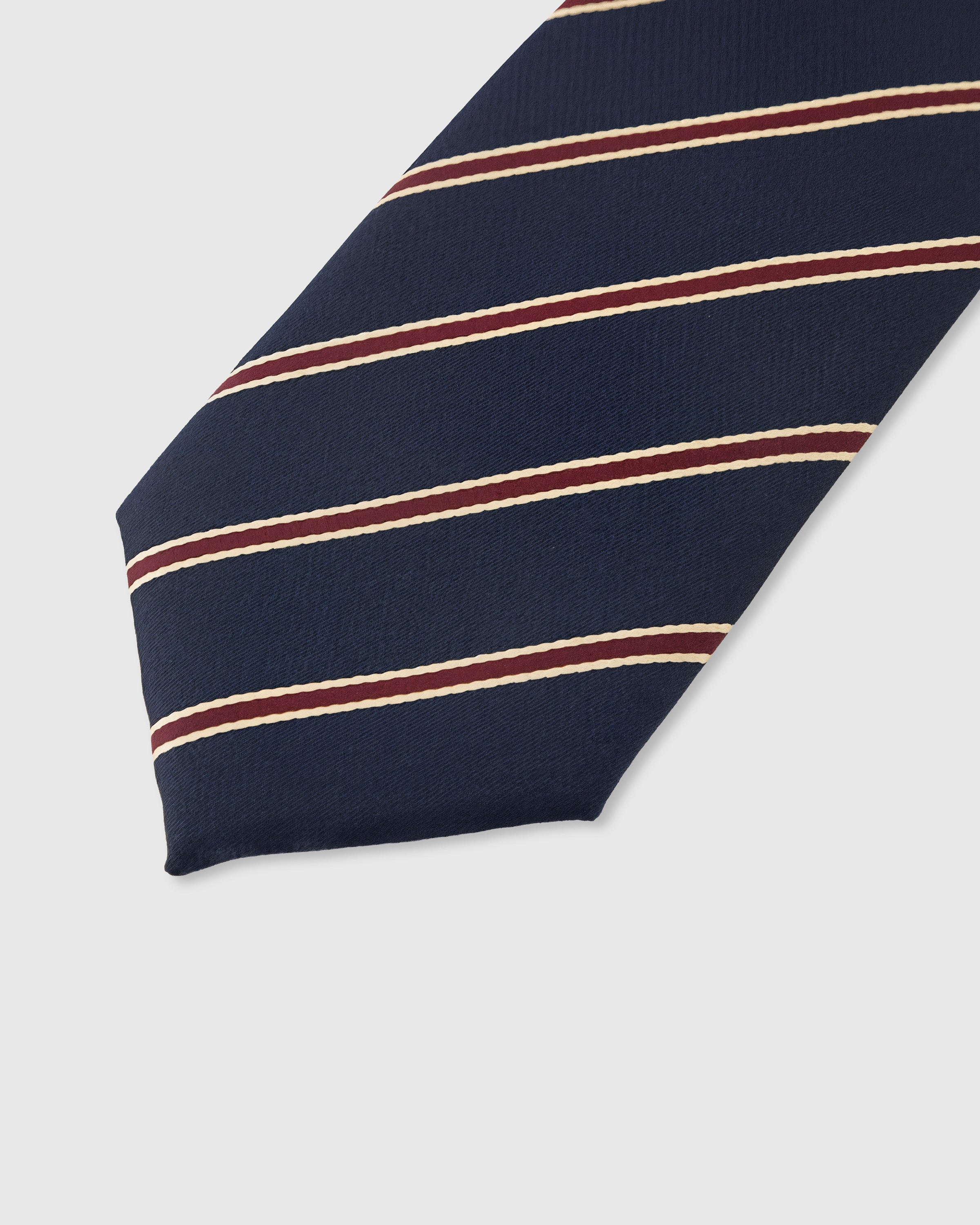 Heritage stripe detail on navy mulberry silk tie showing crimson and gold woven lines by STICKYZOO